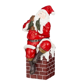 Pere Noël résine sur cheminée 45.5 x 44 ht 98cm
